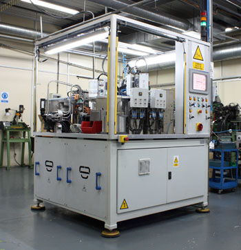 Indexed assembly and leak testing machine for lighter at 16.000 pph
